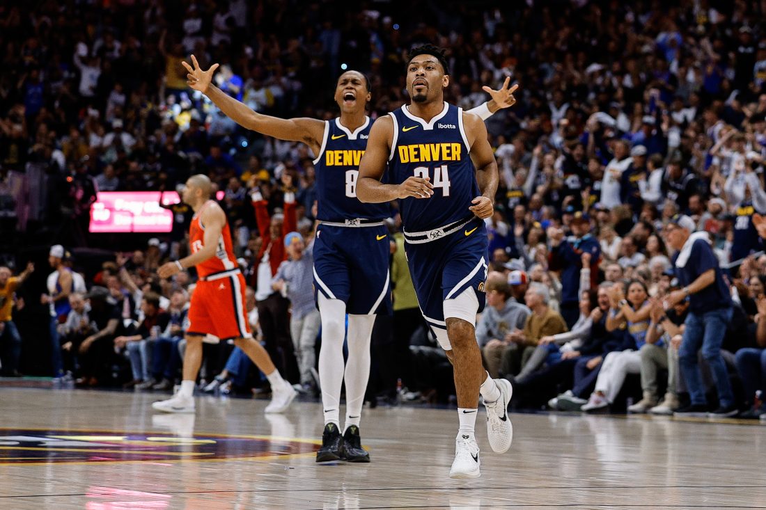 Apr 21, 2025; Denver, Colorado, USA; Denver Nuggets guard Jalen Pickett (24) reacts ahead of forward Peyton Watson (8) after a play in the first quarter against the Los Angeles Clippers during game two of first round for the 2025 NBA Playoffs at Ball Arena. Mandatory Credit: Isaiah J. Downing-Imagn Images