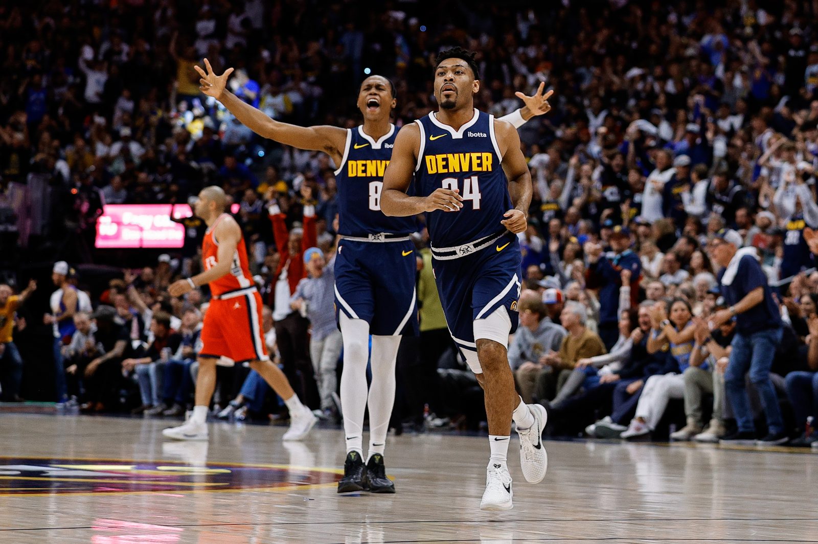 Apr 21, 2025; Denver, Colorado, USA; Denver Nuggets guard Jalen Pickett (24) reacts ahead of forward Peyton Watson (8) after a play in the first quarter against the Los Angeles Clippers during game two of first round for the 2025 NBA Playoffs at Ball Arena. Mandatory Credit: Isaiah J. Downing-Imagn Images