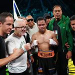 Jul 19, 2025; Las Vegas, Nevada, USA; Manny Pacquiao poses with his training staff after earning a draw against Mario Barrios at MGM Grand Garden Arena. Mandatory Credit: Stephen R. Sylvanie-Imagn Images