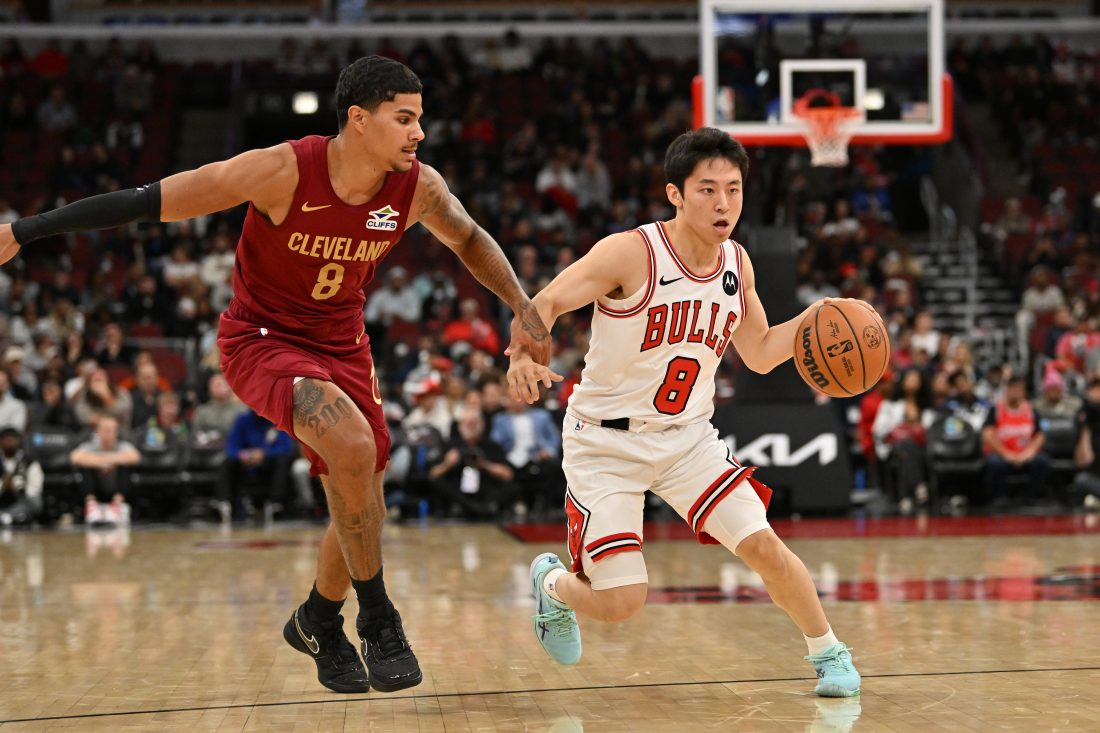 Oct 9, 2025; Chicago, Illinois, USA; Chicago Bulls guard Yuki Kawamura (8) drives the ball against Cleveland Cavaliers guard Killian Hayes (8) during the second half at United Center. Mandatory Credit: Patrick Gorski-Imagn Images