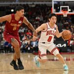 Oct 9, 2025; Chicago, Illinois, USA; Chicago Bulls guard Yuki Kawamura (8) drives the ball against Cleveland Cavaliers guard Killian Hayes (8) during the second half at United Center. Mandatory Credit: Patrick Gorski-Imagn Images