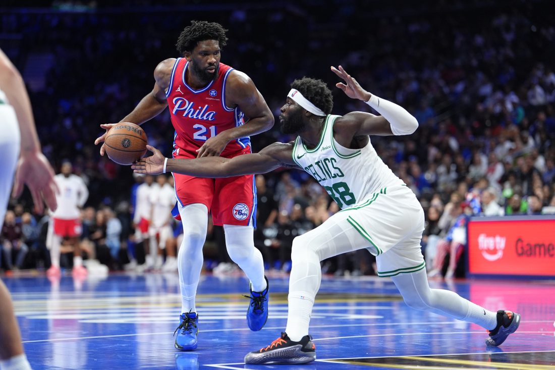 Oct 31, 2025; Philadelphia, Pennsylvania, USA; Boston Celtics center Neemias Queta (88) defends Philadelphia 76ers center Joel Embiid (21) in the third quarter at Xfinity Mobile Arena. Mandatory Credit: Kyle Ross-Imagn Images