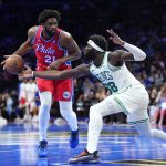 Oct 31, 2025; Philadelphia, Pennsylvania, USA; Boston Celtics center Neemias Queta (88) defends Philadelphia 76ers center Joel Embiid (21) in the third quarter at Xfinity Mobile Arena. Mandatory Credit: Kyle Ross-Imagn Images