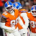 Nov 6, 2025; Denver, Colorado, USA; Denver Broncos defensive end John Franklin-Myers (98) reacts against the Las Vegas Raiders during the first half at Empower Field at Mile High. Mandatory Credit: Ron Chenoy-Imagn Images