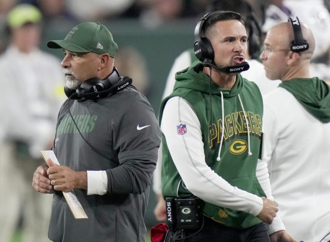 Sep 11, 2025; Green Bay, Wisconsin, USA; Green Bay Packers head coach Matt LaFleur, right, and assistant head coach/special teams coordinator Rich Bisaccia are shown after having to call a time out during the fourth quarter at Lambeau Field.
