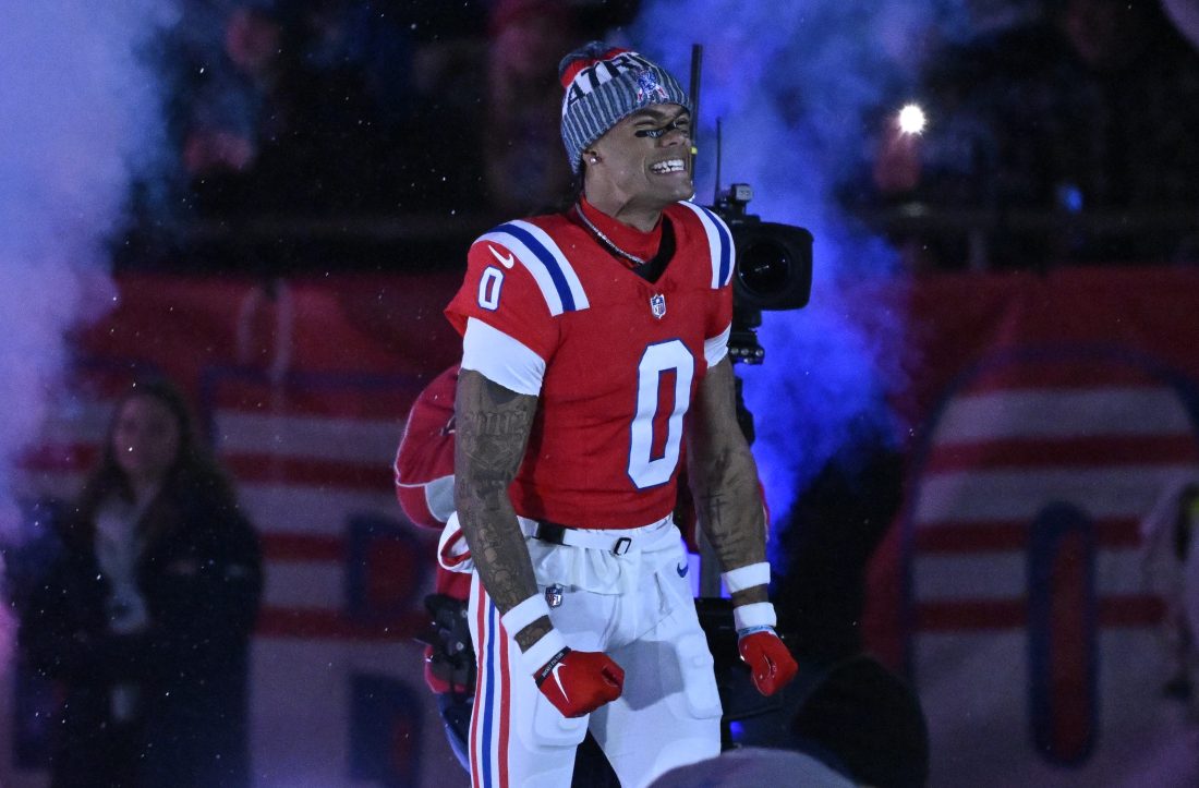 Dec 1, 2025; Foxborough, Massachusetts, USA; New England Patriots cornerback Christian Gonzalez (0) runs onto the field prior to the game against the New York Giants at Gillette Stadium. Mandatory Credit: Eric Canha-Imagn Images