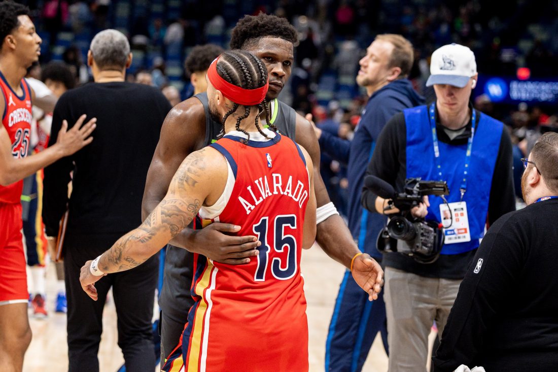 Dec 4, 2025; New Orleans, Louisiana, USA; Minnesota Timberwolves guard Anthony Edwards (5) hugs New Orleans Pelicans guard Jose Alvarado (15) after the game at Smoothie King Center. Mandatory Credit: Stephen Lew-Imagn Images