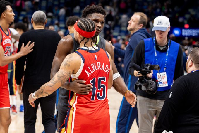 Dec 4, 2025; New Orleans, Louisiana, USA; Minnesota Timberwolves guard Anthony Edwards (5) hugs New Orleans Pelicans guard Jose Alvarado (15) after the game at Smoothie King Center. Mandatory Credit: Stephen Lew-Imagn Images
