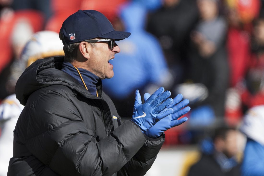 Dec 14, 2025; Kansas City, Missouri, USA; Los Angeles Chargers head coach Jim Harbaugh observes pregame warmups against the Kansas City Chiefs at GEHA Field at Arrowhead Stadium. Mandatory Credit: Denny Medley-Imagn Images