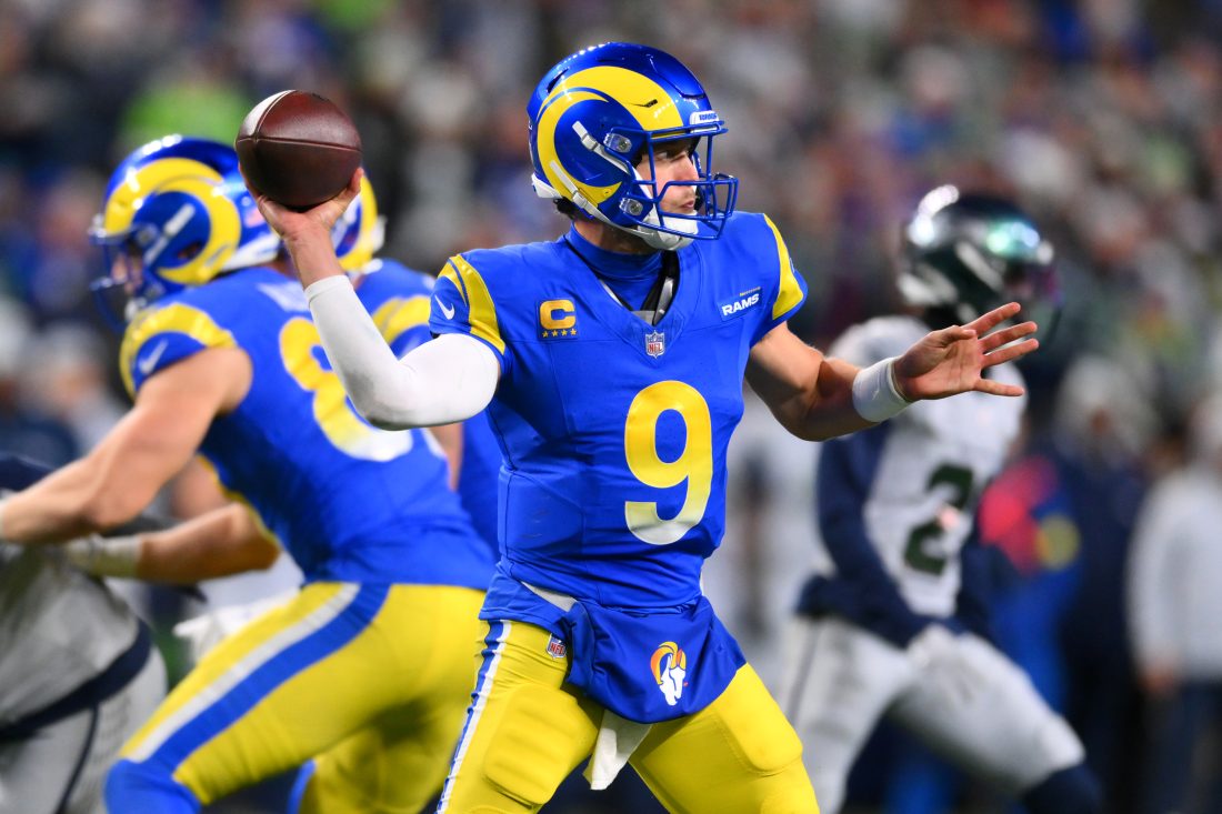 Dec 18, 2025; Seattle, Washington, USA; Los Angeles Rams quarterback Matthew Stafford (9) throws a pass against the Seattle Seahawks in overtime at Lumen Field. Mandatory Credit: Steven Bisig-Imagn Images
