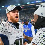 Dec 18, 2025; Seattle, Washington, USA; Seattle Seahawks quarterback Sam Darnold (14) and quarterback Jalen Milroe (6) celebrate after defeating the Los Angeles Rams in overtime at Lumen Field. Mandatory Credit: Steven Bisig-Imagn Images