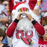 Dec 21, 2025; Glendale, Arizona, USA; Arizona Cardinals fan in the crowd dressed as Santa Claus during the game at State Farm Stadium. Mandatory Credit: Mark J. Rebilas-Imagn Images
