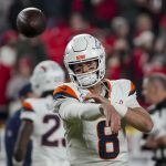 Dec 25, 2025; Kansas City, Missouri, USA; Denver Broncos quarterback Jarrett Stidham (8) warms up before the game at GEHA Field at Arrowhead Stadium.