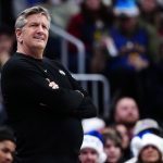 Dec 25, 2025; Denver, Colorado, USA; Minnesota Timberwolves head coach Chris Finch reacts against the Denver Nuggets during the first half at Ball Arena.
