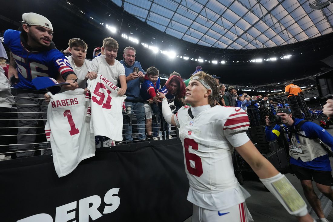 Dec 28, 2025; Paradise, Nevada, USA; New York Giants quarterback Jaxson Dart (6) greets fans after the game against the Las Vegas Raiders at Allegiant Stadium.