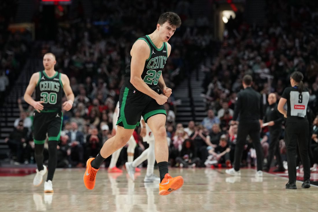 Dec 28, 2025; Portland, Oregon, USA; Boston Celtics guard Hugo Gonzalez (28) celebrates after making a three-point basket during the second half against the Portland Trail Blazers at Moda Center.