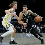 Dec 29, 2025; Brooklyn, New York, USA; Brooklyn Nets forward Michael Porter Jr. (17) drives to the basket against Golden State Warriors guard Brandin Podziemski (2) during the third quarter at Barclays Center.