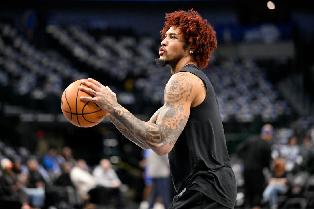 Jan 1, 2026; Dallas, Texas, USA; Philadelphia 76ers guard Kelly Oubre Jr. (9) warms up before the game against the Dallas Mavericks at the American Airlines Center. Mandatory Credit: Jerome Miron-Imagn Images