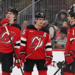 Jan 3, 2026; Newark, New Jersey, USA; New Jersey Devils defenseman Luke Hughes (43), center Jack Hughes (86) and center Nico Hischier (13) talk during the second period of their game against the Utah Mammoth at Prudential Center. Mandatory Credit: Ed Mulholland-Imagn Images