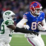 Jan 4, 2026; Orchard Park, New York, USA; Buffalo Bills tight end Dalton Kincaid (86) makes a catch defended by New York Jets cornerback Samuel Womack III (39) during the first half at Highmark Stadium. Mandatory Credit: Mark Konezny-Imagn Images