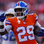 Jan 4, 2026; Denver, Colorado, USA; Denver Broncos cornerback Ja'quan McMillian (29) runs with the ball during the first half against the Los Angeles Chargers at Empower Field at Mile High. Mandatory Credit: Ron Chenoy-Imagn Images