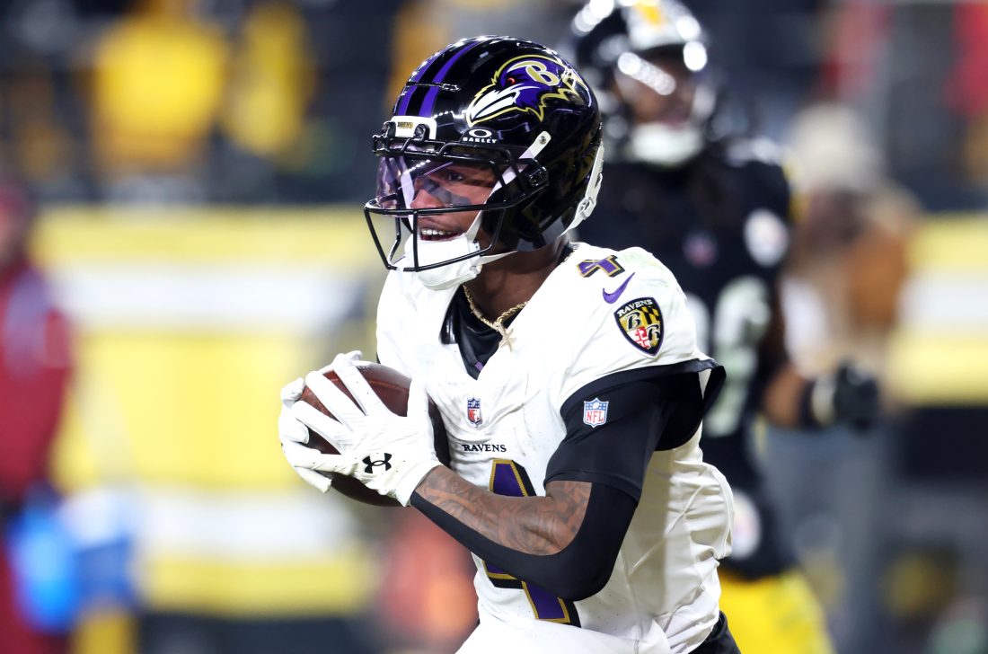 Jan 4, 2026; Pittsburgh, Pennsylvania, USA; Baltimore Ravens wide receiver Zay Flowers (4) makes a touchdown catch against the Pittsburgh Steelers during the second half at Acrisure Stadium. Mandatory Credit: Charles LeClaire-Imagn Images