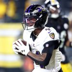 Jan 4, 2026; Pittsburgh, Pennsylvania, USA; Baltimore Ravens wide receiver Zay Flowers (4) makes a touchdown catch against the Pittsburgh Steelers during the second half at Acrisure Stadium. Mandatory Credit: Charles LeClaire-Imagn Images