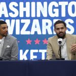 Jan 9, 2026; Washington, District of Columbia, USA; Newly acquired Washington Wizards guard Trae Young (R) speaks at an introductory press conference as Wizards general manager Will Dawkins (L) listens prior to the Wizards' game against the New Orleans Pelicans at Capital One Arena.