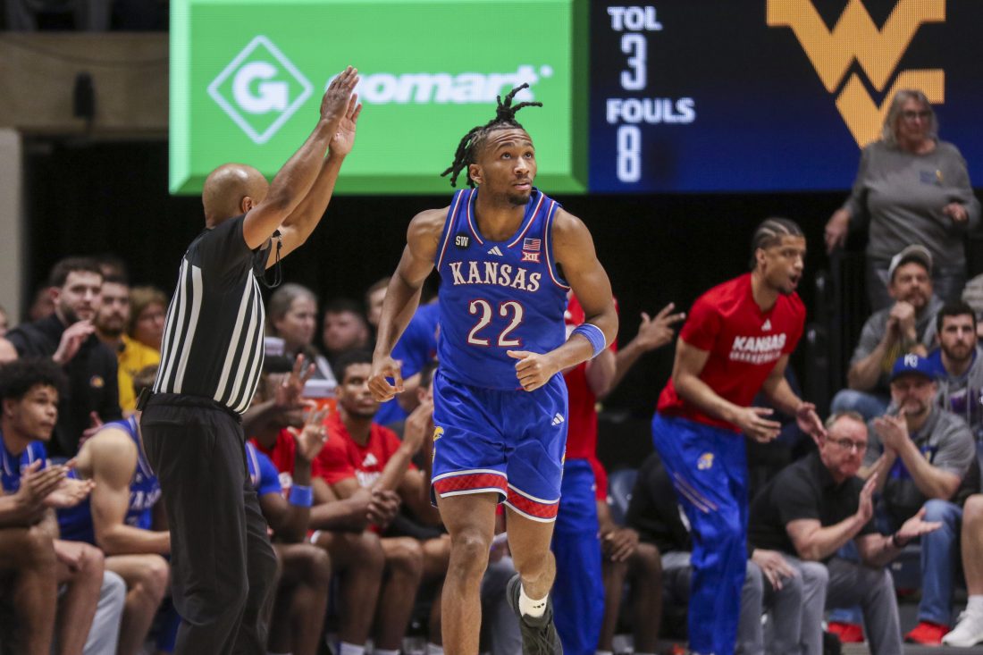 Jan 10, 2026; Morgantown, West Virginia, USA; Kansas Jayhawks guard Darryn Peterson (22) celebrates after a three point basket during the second half against the West Virginia Mountaineers at Hope Coliseum.