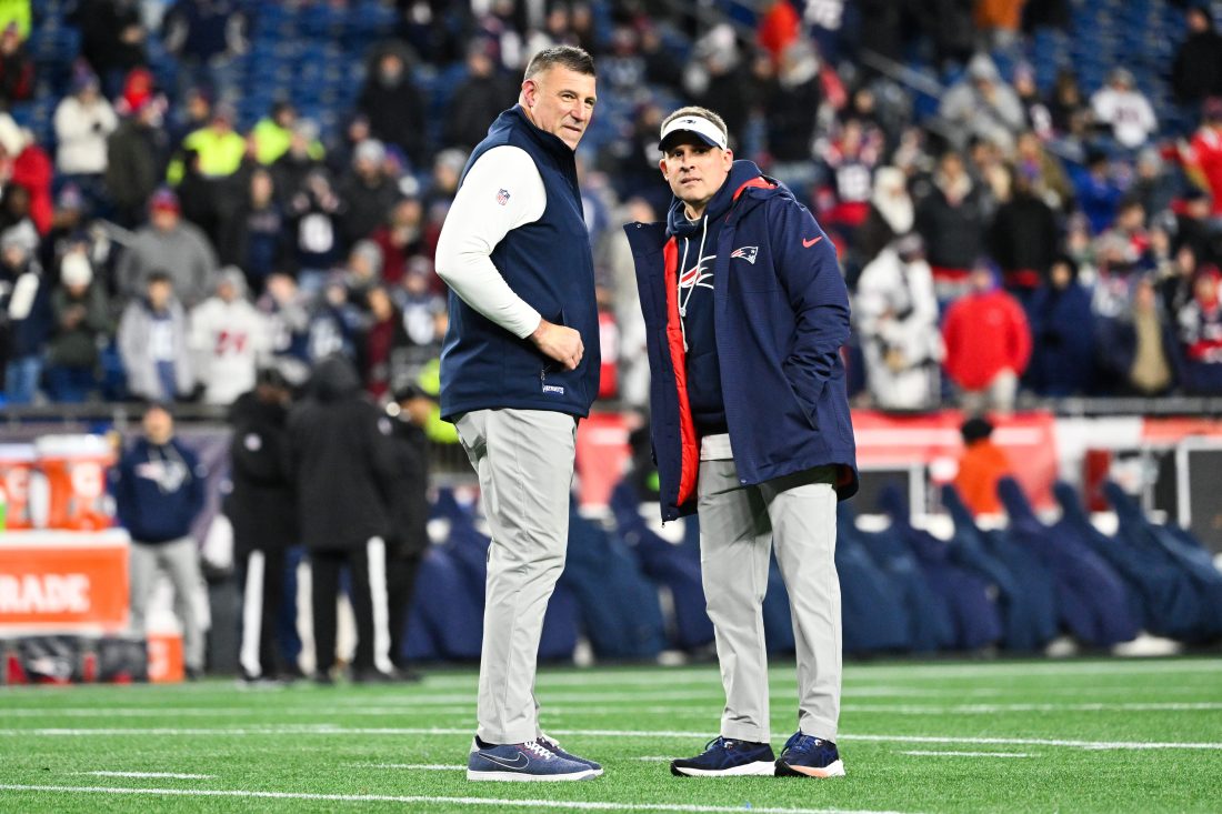 Jan 11, 2026; Foxborough, MA, USA; New England Patriots head coach Mike Vrabel and New England Patriots offensive coordinator Josh McDaniels look on before the game against the Los Angeles Chargers in an AFC Wild Card Round game at Gillette Stadium. Mandatory Credit: Eric Canha-Imagn Images
