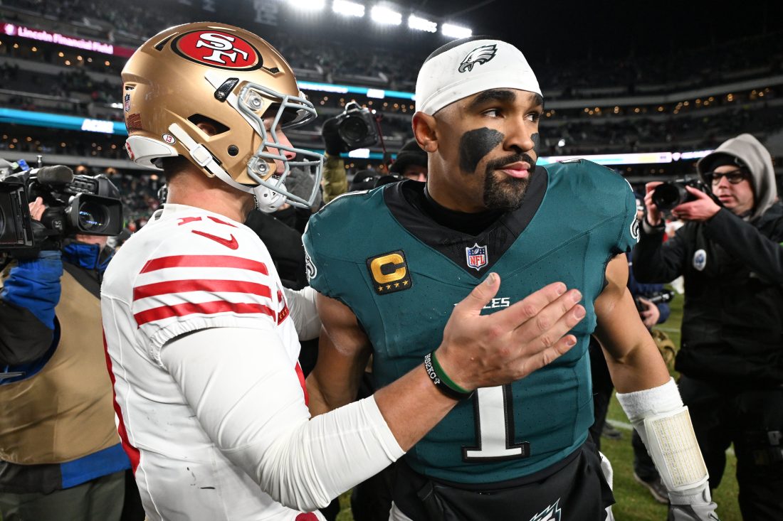Jan 11, 2026; Philadelphia, PA, USA; San Francisco 49ers quarterback Brock Purdy (13) speaks with Philadelphia Eagles quarterback Jalen Hurts (1) after an NFC Wild Card Round game at Lincoln Financial Field. Mandatory Credit: Eric Hartline-Imagn Images