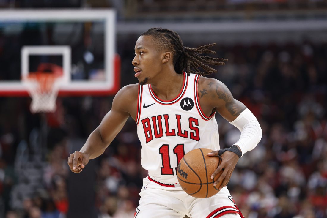 Jan 10, 2026; Chicago, Illinois, USA; Chicago Bulls guard Ayo Dosunmu (11) brings the ball up court against the Dallas Mavericks during the first half at United Center.