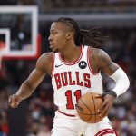 Jan 10, 2026; Chicago, Illinois, USA; Chicago Bulls guard Ayo Dosunmu (11) brings the ball up court against the Dallas Mavericks during the first half at United Center.