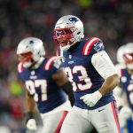 Jan 11, 2026; Foxborough, MA, USA; New England Patriots linebacker Anfernee Jennings (33) celebrates a sack during the fourth quarter against the Los Angeles Chargers in an AFC Wild Card Round game at Gillette Stadium.