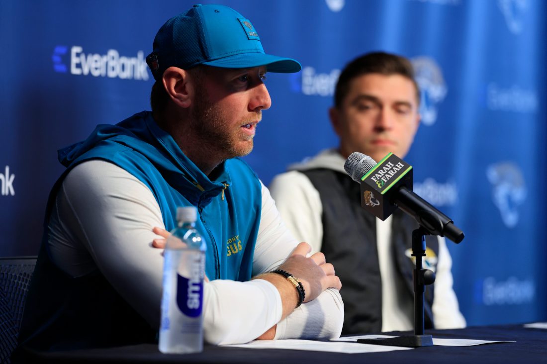 Jacksonville Jaguars head coach Liam Coen speaks during a press conference as general manager James Gladstone looks on at the Miller Electric Center, Wednesday, Jan. 14, 2026, in Jacksonville, Fla.