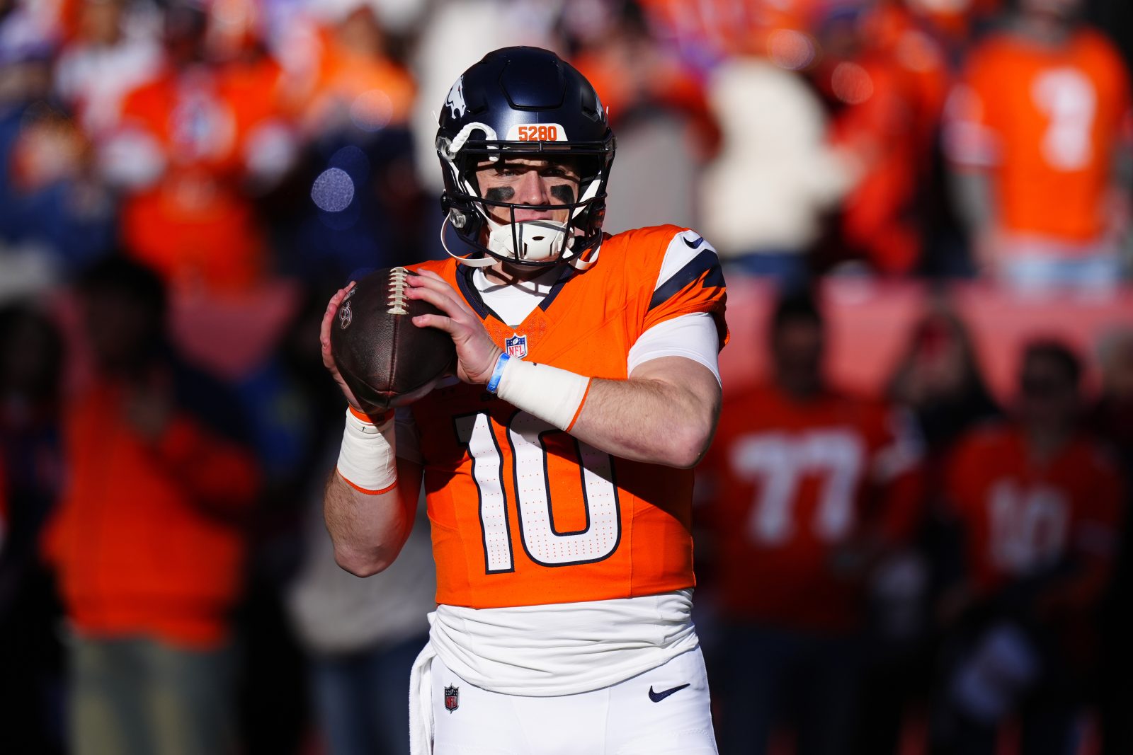 Jan 17, 2026; Denver, CO, USA; Denver Broncos quarterback Bo Nix (10) warms up before an AFC Divisional Round playoff game against the Buffalo Bills at Empower Field at Mile High.