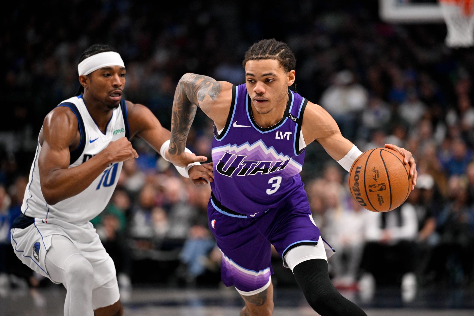 Jan 17, 2026; Dallas, Texas, USA; Utah Jazz guard Keyonte George (3) drives to the basket past Dallas Mavericks guard Brandon Williams (10) during the second quarter at the American Airlines Center.