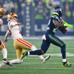Jan 17, 2026; Seattle, WA, USA; Seattle Seahawks wide receiver Rashid Shaheed (22) returns a kickoff for a touchdown as San Francisco 49ers place kicker Eddy Pineiro (18) attempts to trip him up during the first half in an NFC Divisional Round game at Lumen Field. Mandatory Credit: Steven Bisig-Imagn Images