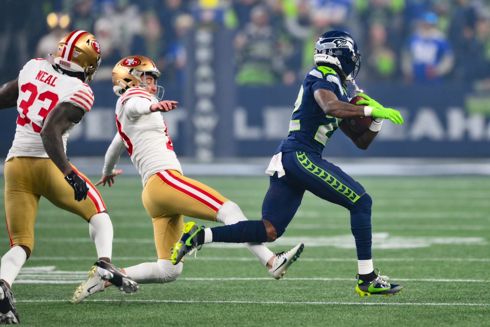 Jan 17, 2026; Seattle, WA, USA; Seattle Seahawks wide receiver Rashid Shaheed (22) returns a kickoff for a touchdown as San Francisco 49ers place kicker Eddy Pineiro (18) attempts to trip him up during the first half in an NFC Divisional Round game at Lumen Field. Mandatory Credit: Steven Bisig-Imagn Images