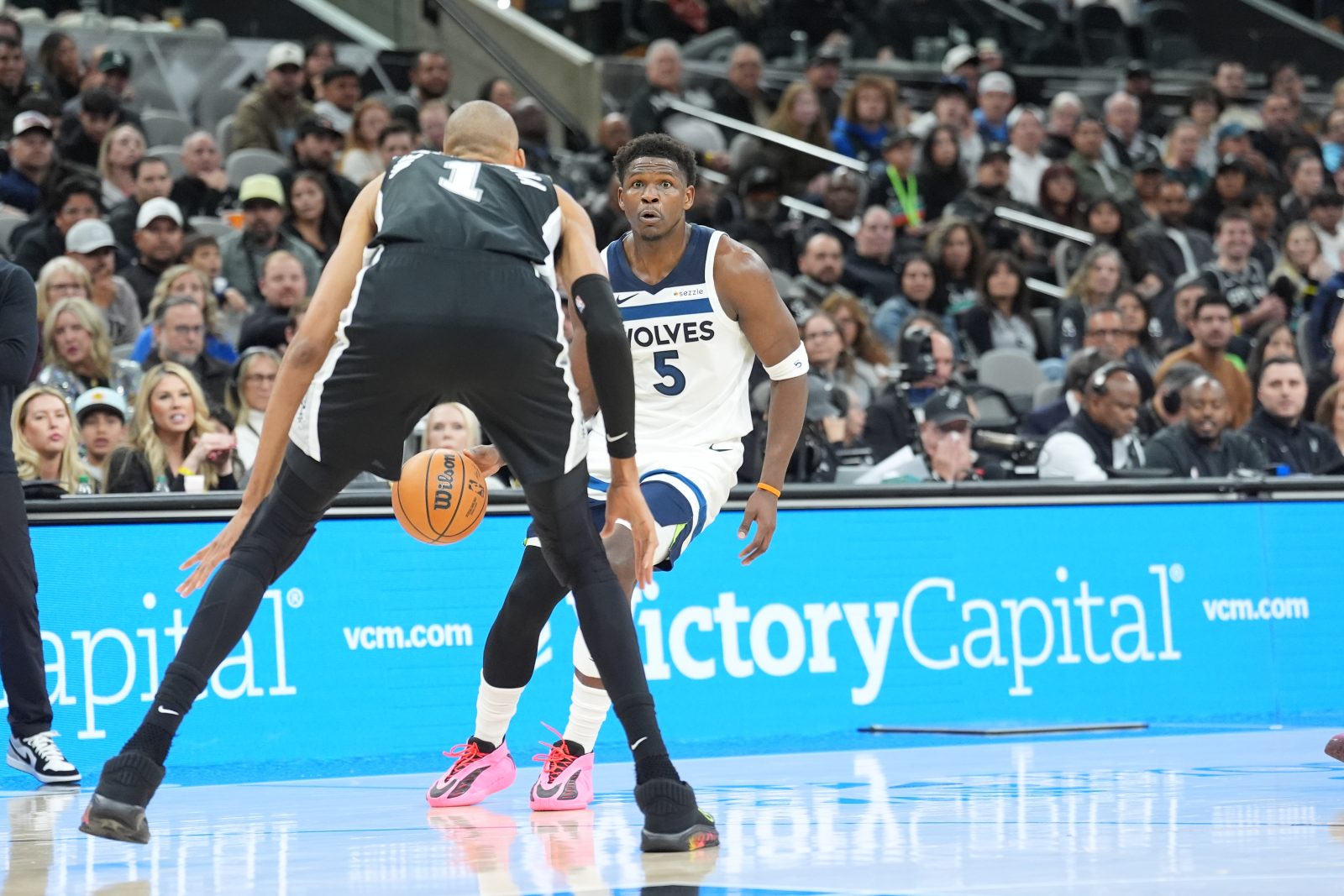 Jan 17, 2026; San Antonio, Texas, USA; Minnesota Timberwolves guard Anthony Edwards (5) dribbles in front of San Antonio Spurs forward Victor Wembanyama (1) in the first half at Frost Bank Center. Mandatory Credit: Daniel Dunn-Imagn Images