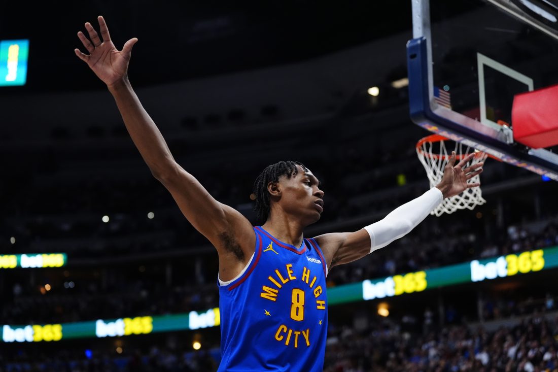 Jan 18, 2026; Denver, Colorado, USA; Denver Nuggets guard Peyton Watson (8) during the first quarter against the Charlotte Hornets at Ball Arena.
