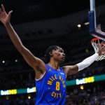 Jan 18, 2026; Denver, Colorado, USA; Denver Nuggets guard Peyton Watson (8) during the first quarter against the Charlotte Hornets at Ball Arena.