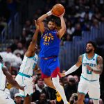 Jan 18, 2026; Denver, Colorado, USA; Charlotte Hornets guard Collin Sexton (8) defends Denver Nuggets guard Jamal Murray (27)in the second quarter at Ball Arena.