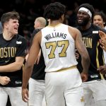Jan 23, 2026; Brooklyn, New York, USA; Boston Celtics guard Hugo Gonzalez (28) and forward Amari Williams (77) and center Neemias Queta (88) celebrate after defeating the Brooklyn Nets in double overtime at Barclays Center. Mandatory Credit: Brad Penner-Imagn Images