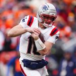 Jan 25, 2026; Denver, CO, USA; New England Patriots quarterback Drake Maye (10) rushes the ball for a touchdown against the Denver Broncos during the first half in the 2026 AFC Championship Game at Empower Field at Mile High. Mandatory Credit: Ron Chenoy-Imagn Images