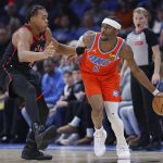 Jan 25, 2026; Oklahoma City, Oklahoma, USA; Oklahoma City Thunder guard Shai Gilgeous-Alexander (2) moves the ball around Toronto Raptors forward/guard Scottie Barnes (4) during the second half at Paycom Center. Mandatory Credit: Alonzo Adams-Imagn Images