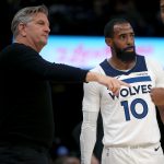 Jan 31, 2026; Memphis, Tennessee, USA; Minnesota Timberwolves head coach Chris Finch (left) talks with guard Mike Conley (10) during the third quarter against the Memphis Grizzlies at FedExForum. Mandatory Credit: Petre Thomas-Imagn Images