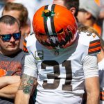 A sad Cleveland Browns fan wearing a pumpkin in the stands during game against Miami Dolphins during NFL action Sunday November 13, 2022 at Hard Rock Stadium in Miami Gardens.