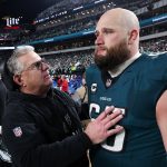 Jan 26, 2025; Philadelphia, PA, USA; Philadelphia Eagles assistant coach Jeff Stoutland (L) and offensive tackle Lane Johnson (65) in the final minute of a victory in the NFC Championship game against the Washington Commanders at Lincoln Financial Field. Mandatory Credit: