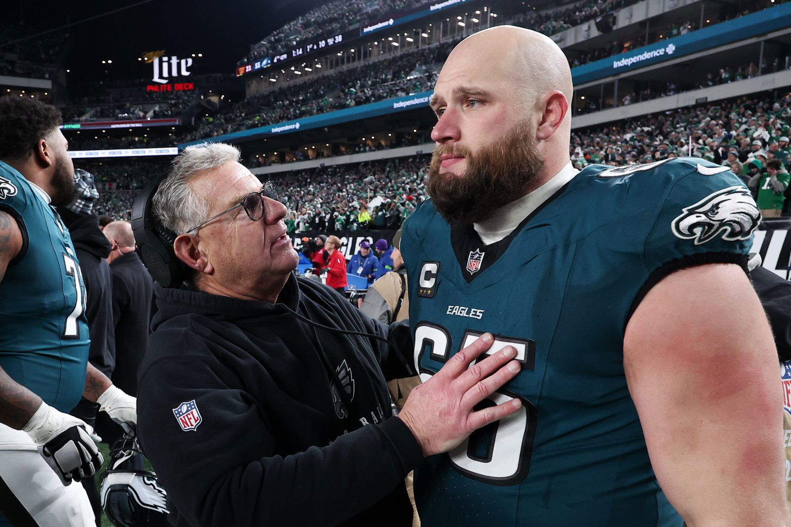 Jan 26, 2025; Philadelphia, PA, USA; Philadelphia Eagles assistant coach Jeff Stoutland (L) and offensive tackle Lane Johnson (65) in the final minute of a victory in the NFC Championship game against the Washington Commanders at Lincoln Financial Field. Mandatory Credit: